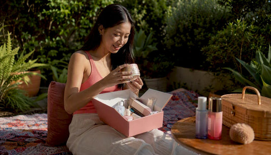 Young woman unpacking skincare mystery box